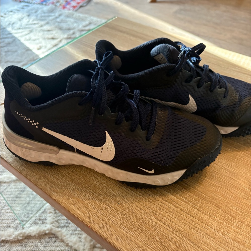 Nike navy and white Alpha Huarache turf baseball cleats.